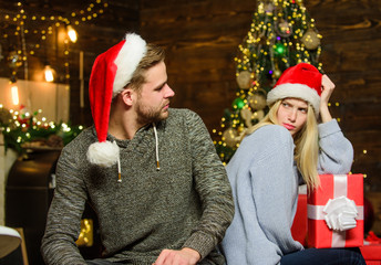 My couple. loving couple portrait. merry christmas. Winter shopping sales. Man and woman on party. wait for xmas gift and present. family celebrate new year. couple in love red santa hat