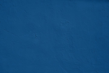 Elegant classic blue colored Concrete textured background with roughness and irregularities to your design or product. 2020 color of the year trend concept.