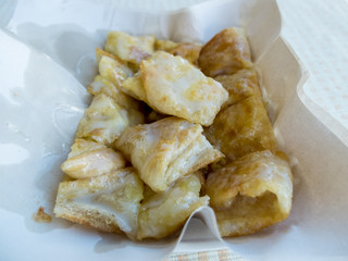 Sweet Roti with milk and sugar on paper plate