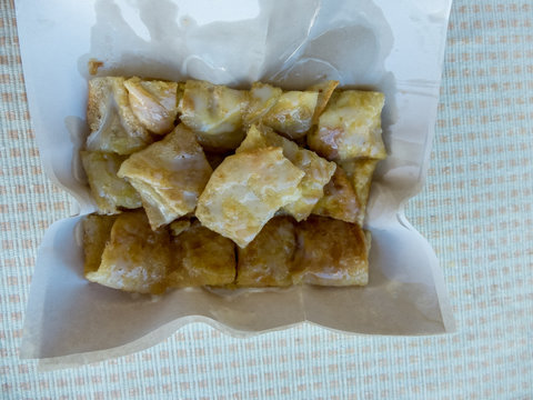 Sweet Roti with milk and sugar on paper plate