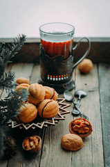 Nuts for tea on a wooden table. Winter