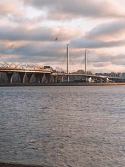Yacht bridge and stadium in St. Petersburg, early winter, cold gray sky with glimpses of the sun