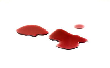 Spilled red wine puddle isolated on white background.