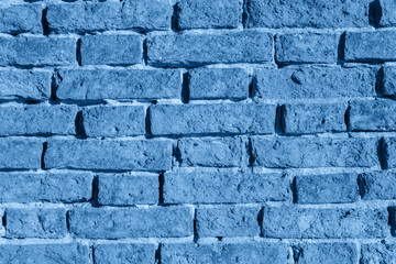 Trendy Color of the year 2020 Classic Blue old brick wall texture grunge for decorative design, banner, card. Aged trend colour rough dirty background. Wallpaper messy cracked surface