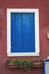 Trendy Color of the year 2020 Classic Blue old italian window background. Outdoor architecture decoration. Mediterranean culture tourism.