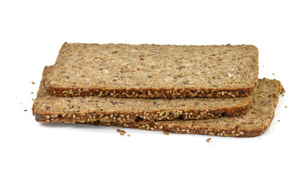 Slices of wholemeal dark bread isolated on a white background in close-up (high details)