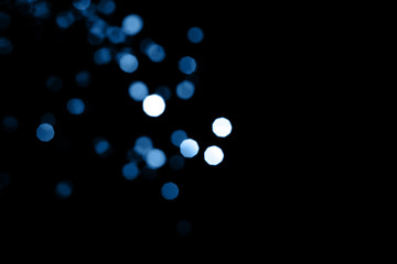 color of year, shinig blue bokeh on black background, 2020, overlay layer.