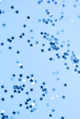 Festive background. Glitter stars on background.