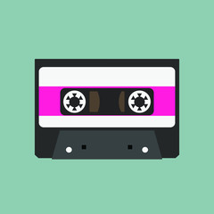 Audio cassette on green background