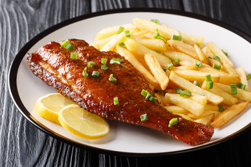 Healthy food fried red perch fish with French fries close-up in a plate. horizontal