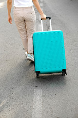 Woman with suitcase. Girl with Trunk luggage. Vacation, Travel, summer holiday, adventure, trip concept. Rear view