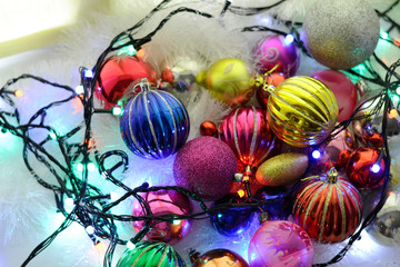 Christmas colorful shiny Cristmas balls with shimmering garland and fluffy decor