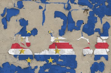 Cabo verde flag depicted in paint colors on old obsolete messy concrete wall closeup. Textured...