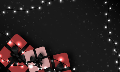 Christmas dark background with gifts and lights.