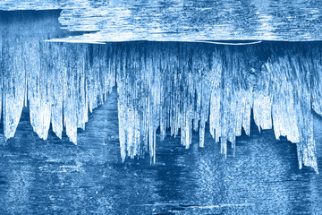 Layers of blue grungy old weathered pastel monochromatic peeling ply wood wall background texture