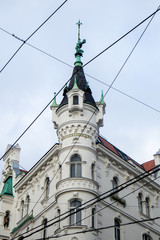 Fototapeta na wymiar Neustiftgasse, house with tower and spire in Austria (Vienna / Wien)