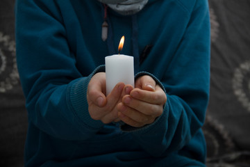 man holding a candle