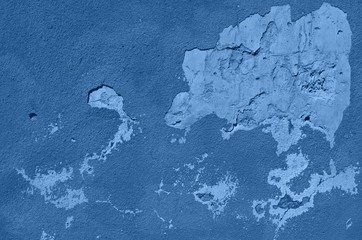 Old cracked calm wall. Painted texture background in monochrome color. Trendy blue and calm color. Banner