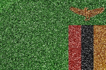 Zambia flag depicted on many small shiny sequins. Colorful festival background for party