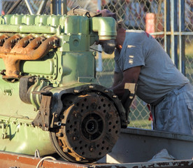 KRAGUJEVAC,SERBIA - JULY 29. 2017: A car mechanic repairs the Mercedes-Benz engine