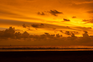 Bright and bold fiery orange skies over the sea