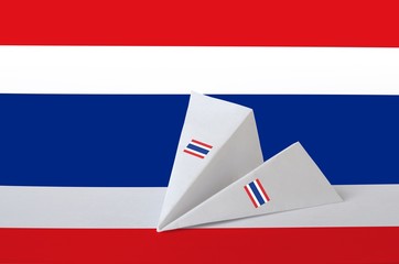 Thailand flag depicted on paper origami airplane. Handmade arts concept