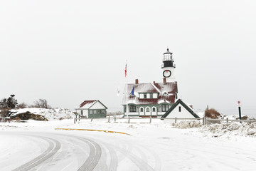 view of the lighthouse in Portland with the park. USA. Maine. Winter day.