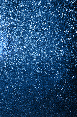 Blue colored blured sparkling background with focused area.