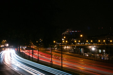 Light traffic in a city by night, Paris, France