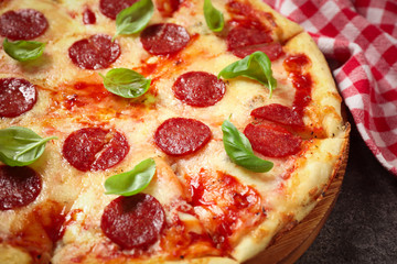 Hot delicious pepperoni pizza on table, closeup
