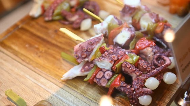 A wide variety of traditional tapas with seafood in Spain at the San Miguel market