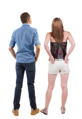 Back view of couple. beautiful friendly girl and guy together.