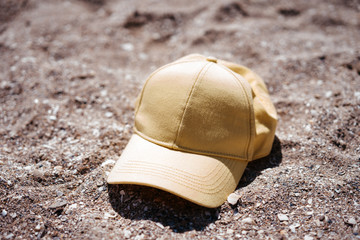 yellow cap on the beach, sun protection