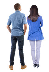 Back view of couple. beautiful friendly girl and guy together.