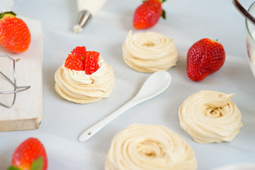 small strawberry pavlova meringue cakes pattern with cream top view
