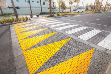 Modern bright pedestrian crosswalk. Urbanism and road safety concept