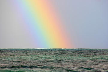 The magic view to beautiful rainbow over the ocean from the coast of Mauritius Island,Africa