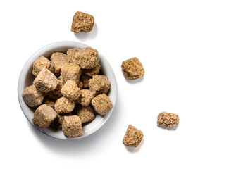 brown lump sugar on white background