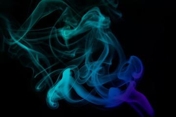 Fototapeta premium multicolored smoke photo against black background