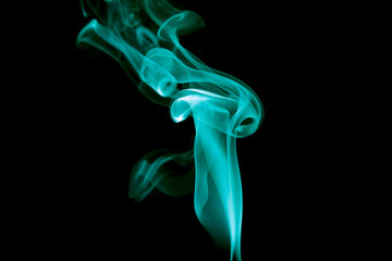 Obraz premium single colored smoke aginst black background