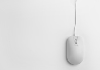 Modern wired optical mouse on white background, top view