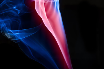 Fototapeta premium multicolored smoke photo against black background