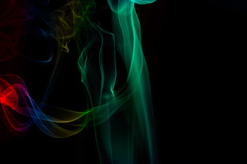 Fototapeta premium multicolored smoke photo against black background