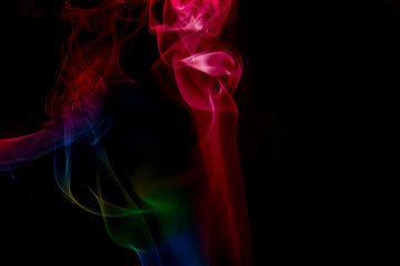 Fototapeta na wymiar multicolored smoke photo against black background