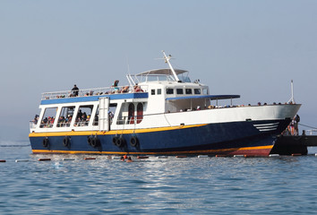 BUDVA,MONTENEGRO-  AUGUST 4.2017: Boat with tourists in the Adriatic Sea