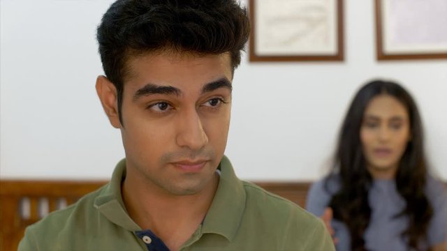 Young Indian couple fighting and arguing in their bedroom. Indian Stock Footage of wife screaming at her husband in anger and husband getting frustrated