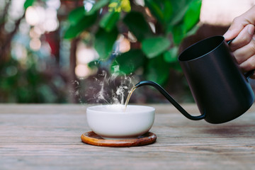 Country hot tea, Pouring tea onto the teacup, Close-up