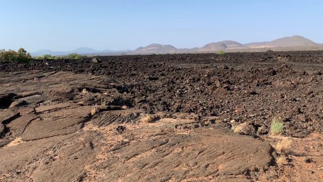 Shetani lava flows in Tsavo West National Park, Kenya, Africa. Patterned rock structures formed from molten lava untypically on a plain.