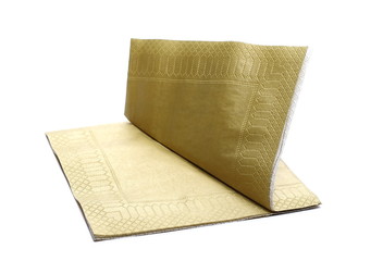Golden paper napkin, serviette isolated on white background