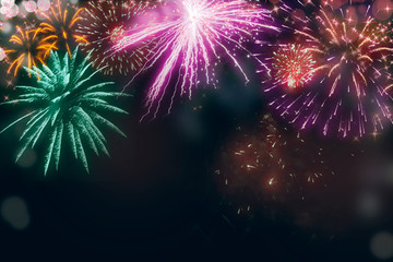 Holiday fireworks illustration; Abstract  colored fireworks background with copy space for text